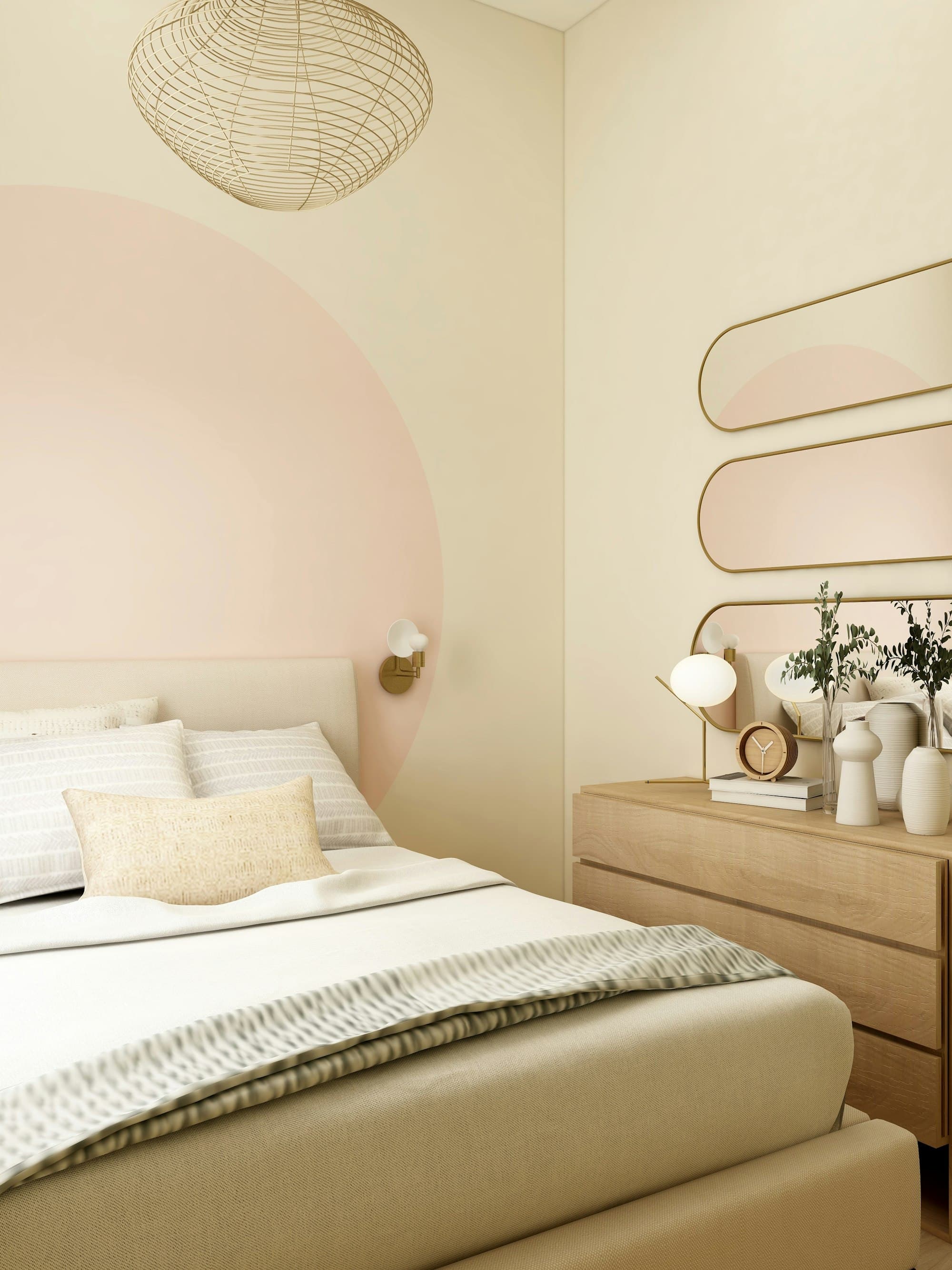 Soft bedroom in cream and blush with a low upholstered bed