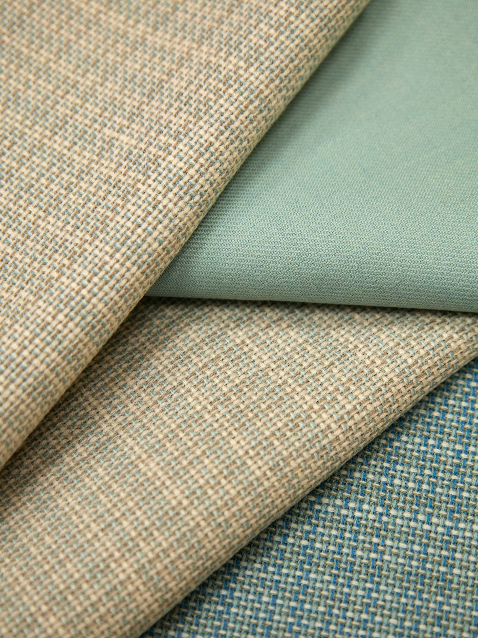 Folded upholstery fabrics in sage and oatmeal