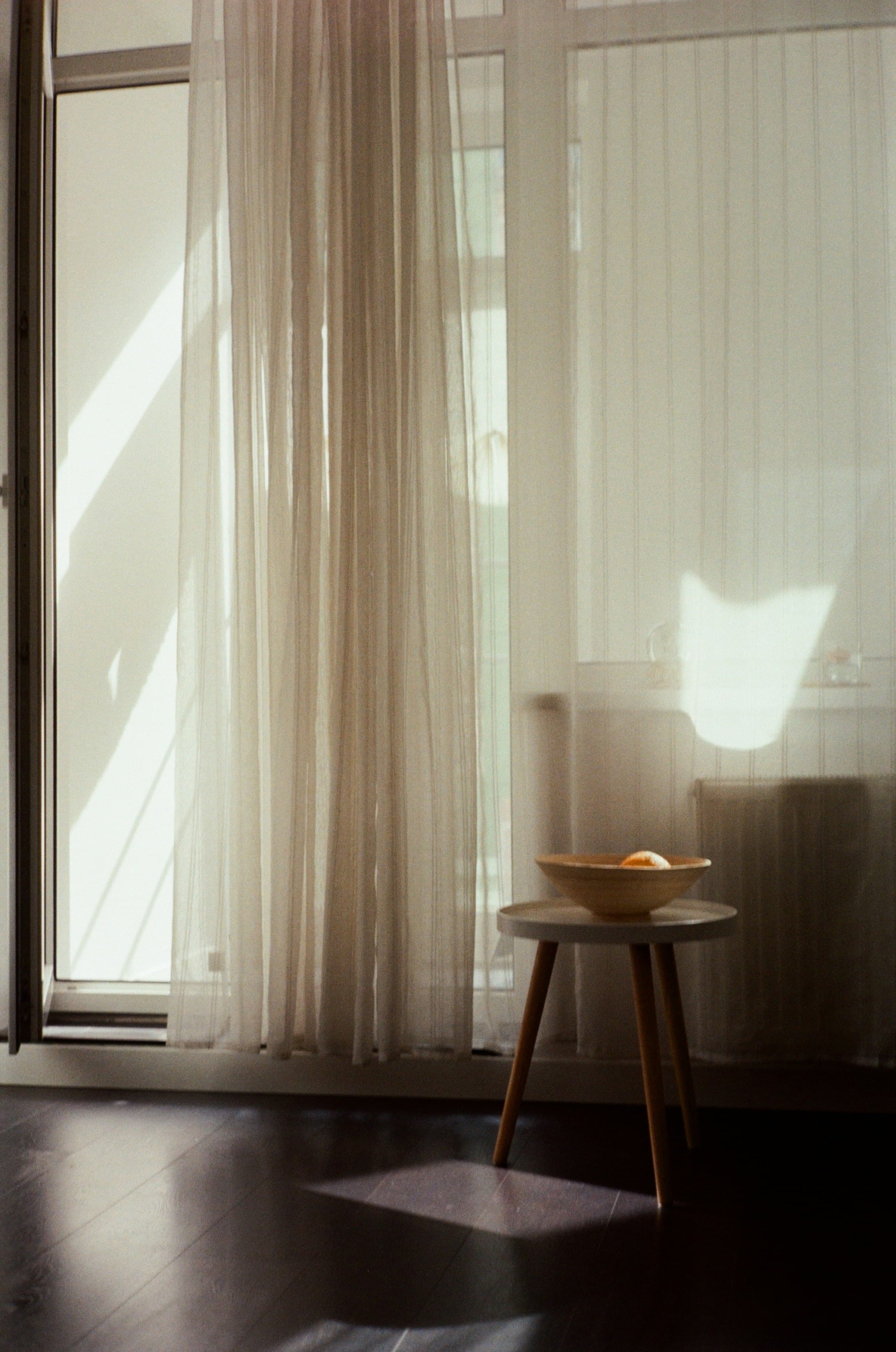 Sheer curtains glowing in morning light